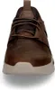 A front view of a brown Skechers shoe. Voir les images du produit