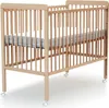 A baby crib with a mattress on a white background. Anteprima dell’immagine prodotto