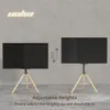 Two TV stands are shown on a concrete floor against a concrete wall. The left stand has a TV at a lower height, and the right stand has a TV at a higher height. Text indicates adjustable heights. Produktbild-Vorschau