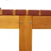 A close-up view of the wooden frame and red fabric straps of a sun lounger. Podgląd zdjęcia produktu