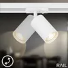 A white track light fixture with two adjustable spotlight heads mounted on a white track. Produktbild-Vorschau