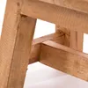 A close-up view of the wooden structure of a stool or small table. Produktbild-Vorschau