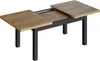 An extendable dining table with a wood-effect top and dark metal legs, shown in a studio setting against a white background. Produktbild-Vorschau