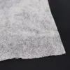 A close-up view of a piece of gray non-woven fabric. Produktbild-Vorschau