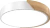 A modern ceiling light with a white and wood finish. Voir les images du produit