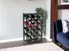 A metal wine rack filled with wine bottles is placed in a room next to a blue sofa and a plant. Produktbild-Vorschau