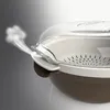 Close-up of a steaming pot with a transparent lid. Voir les images du produit