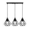 A black pendant light fixture with three geometric metal shades. Produktbild-Vorschau