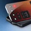A close-up shot of a smartphone with a transparent case and black frame, showing various icons and controls on the screen. Produktbild-Vorschau