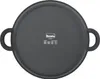 The bottom view of a black frying pan with two handles and a logo in the center. Produktbild-Vorschau