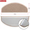 Two views of a beige, semi-circular stair mat. The top view shows the carpeted surface and the bottom view shows the non-slip backing with adhesive strips. Dimensions are indicated. Produktbild-Vorschau