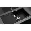 A close-up view of a black kitchen sink with a silver faucet and drain. Produktbild-Vorschau