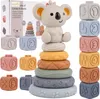 A collection of baby stacking toys, including blocks with numbers and shapes, and a koala-themed stacking ring toy, arranged on a white background. Voir les images du produit