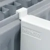 A close-up view of a white radiator drying rack attached to a gray radiator. Produktbild-Vorschau