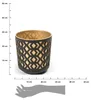 A black and gold patterned pot is shown with a ruler and hand scale for size reference. Podgląd zdjęcia produktu