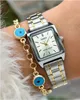A close-up shot of a woman's wrist wearing a Casio watch and a bracelet with evil eye charms. Podgląd zdjęcia produktu