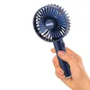 A hand holding a portable fan. Anteprima dell’immagine prodotto