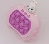 A pink toy game with a rabbit on top. Produktbild-Vorschau