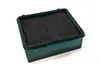 A green plastic container with a black mesh insert, shown from a slightly elevated angle against a white background. Produktbild-Vorschau