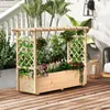 A wooden planter box with a trellis and a roof, filled with various plants and flowers, sits on a wooden deck. Náhled obrázku produktu
