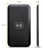 A black wireless charger is shown with dimensions indicated. Produktbild-Vorschau