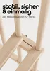 Close-up view of the wooden structure of a playpen, highlighting its stability and construction. Produktbild-Vorschau