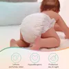 A baby wearing a diaper is crawling on a bed. Below the baby are three icons with text describing product features. Produktbild-Vorschau