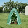A green greenhouse tent with plants inside, set up on a grassy lawn with trees and buildings in the background. Náhľad obrázku produktu