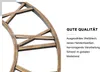 Close-up of a decorative metal wall clock with Roman numerals and descriptive text about its quality. Produktbild-Vorschau