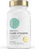 A white bottle of hair vitamins with a gold cap. Produktbild-Vorschau