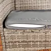A close-up view of a grey cushion on a rattan garden bench. Produktbild-Vorschau