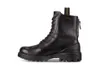 A studio shot of a black boot on a white background. Produktbild-Vorschau