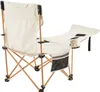 A single beige camping chair with a footrest and cup holder, shown from a side-back angle against a white background. Produktbild-Vorschau