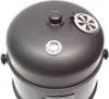 A close-up, top-down view of a black smoker grill. Produktbild-Vorschau