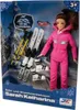 A doll in a pink ski suit with winter sports accessories, presented in its retail packaging. Náhľad obrázku produktu