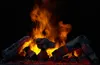 A close-up shot of burning logs in a fireplace, with flames and embers visible. Anteprima dell’immagine prodotto