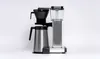 A coffee maker with a thermos is shown against a white background. Produktbild-Vorschau