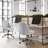 Two light gray office chairs are shown in a modern office setting with large windows. Podgląd zdjęcia produktu