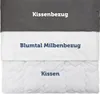 A layered image showing a pillow and its covers, with text labels for each component. Voir les images du produit