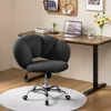 A modern home office setup with a desk, chair, laptop, and decorative items. Produktbild-Vorschau