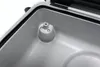 Close-up view of the interior of a vacuum sealer machine, showing a mounting point with screws. Podgląd zdjęcia produktu