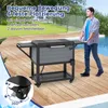 A man is pushing a cooler cart next to a swimming pool on a wooden deck. Podgląd zdjęcia produktu