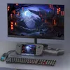 A computer monitor displays a fantasy landscape, with a handheld gaming device, keyboard, mouse, and controller arranged in front of it. Produktbild-Vorschau