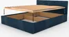 A dark blue upholstered bed frame with the wooden slatted base being lowered into place, illustrating storage space within the bed frame. Produktbild-Vorschau