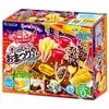 A colorful box of a Japanese DIY candy kit, featuring illustrations of festival foods like french fries, corn on the cob, and chocolate-covered bananas. Produktbild-Vorschau