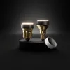 Two LED light bulbs and a ring are displayed on a black surface with a dark background. Produktbild-Vorschau
