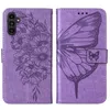 A purple leather flip case for a Samsung Galaxy A25 5G phone, featuring embossed floral and butterfly designs. Produktbild-Vorschau