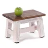 A small wooden stool with a green apple on top, set against a white background. Produktbild-Vorschau