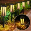 Solar garden lights illuminating a path at night, casting decorative shadows. Produktbild-Vorschau