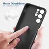 A hand is touching the inside of a black phone case, with cotton balls in the background. Produktbild-Vorschau